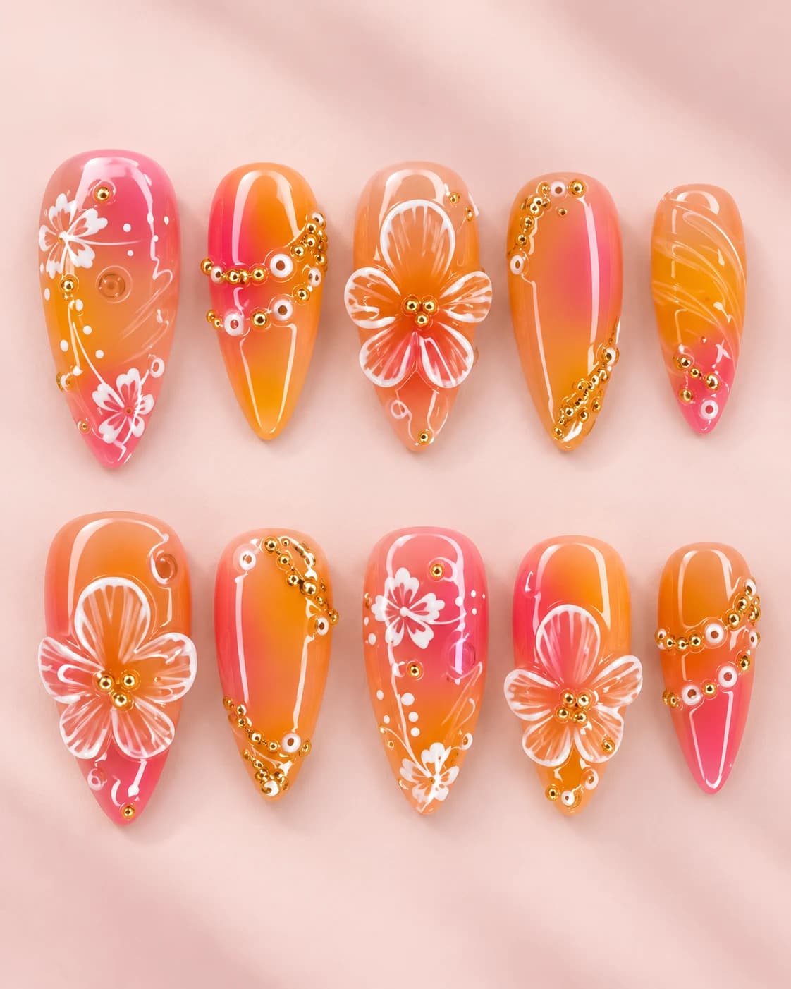 Peach Glow: muestra de diez uñas sobre fondo rosa